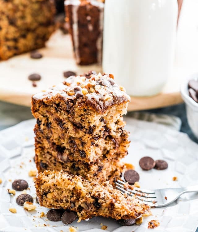 side view shot of a fork taking slicing a piecing a banana chocolate chip coffee cake