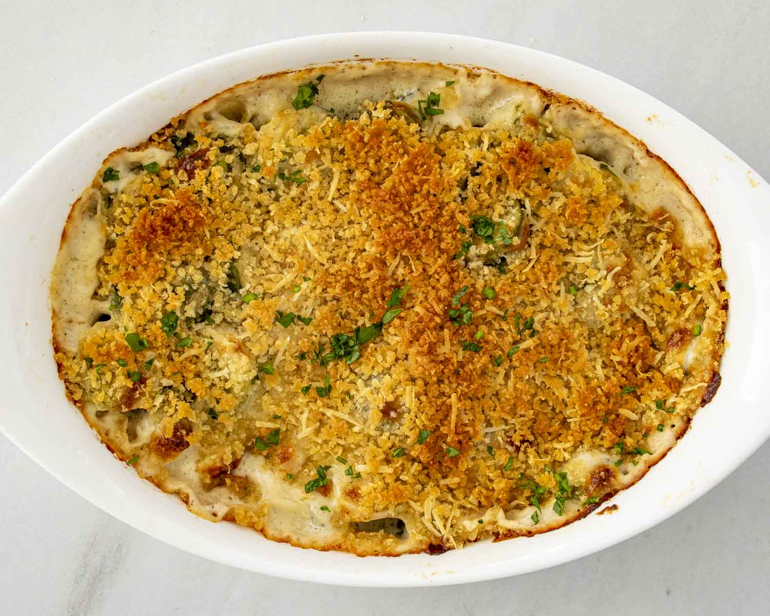 process shots showing how to make brussels sprouts gratin.