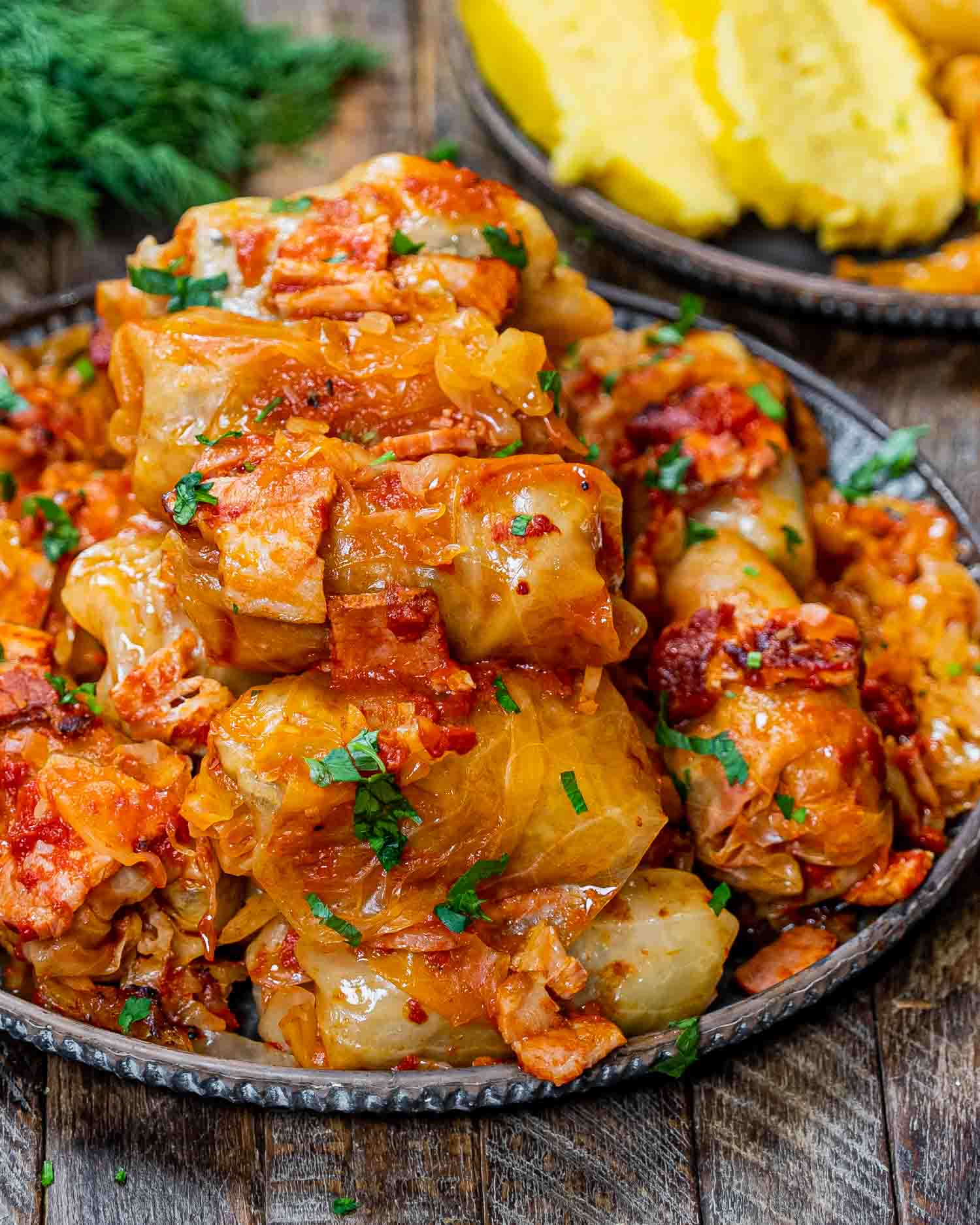 a plate stacked with freshly cooked romanian cabbage rolls.
