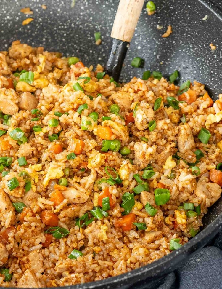 freshly made chicken fried rice in a wok.
