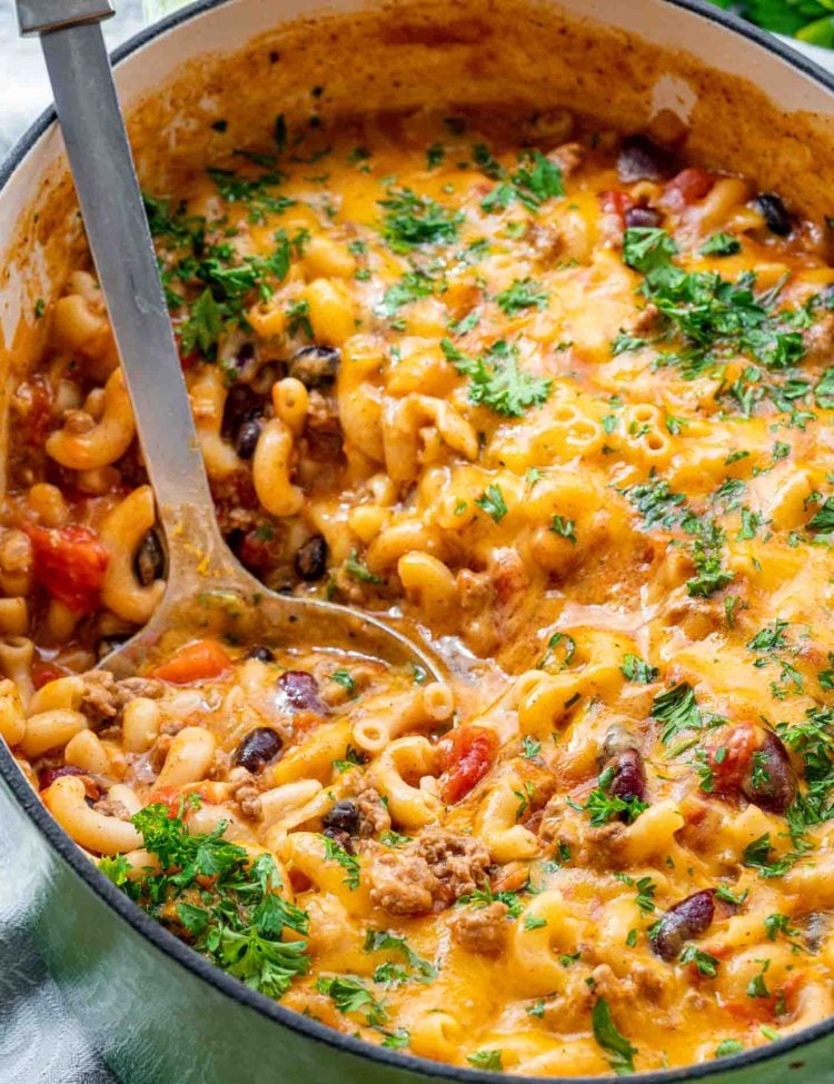 freshly made chili mac and cheese in a Dutch oven.