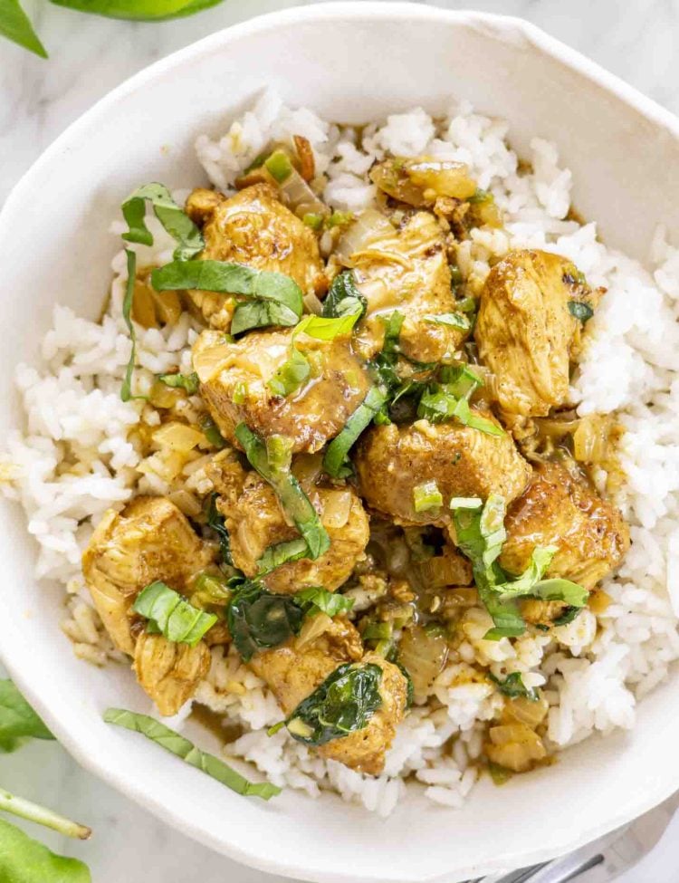 overhead shot of a bowl of coconut basil chicken curry.