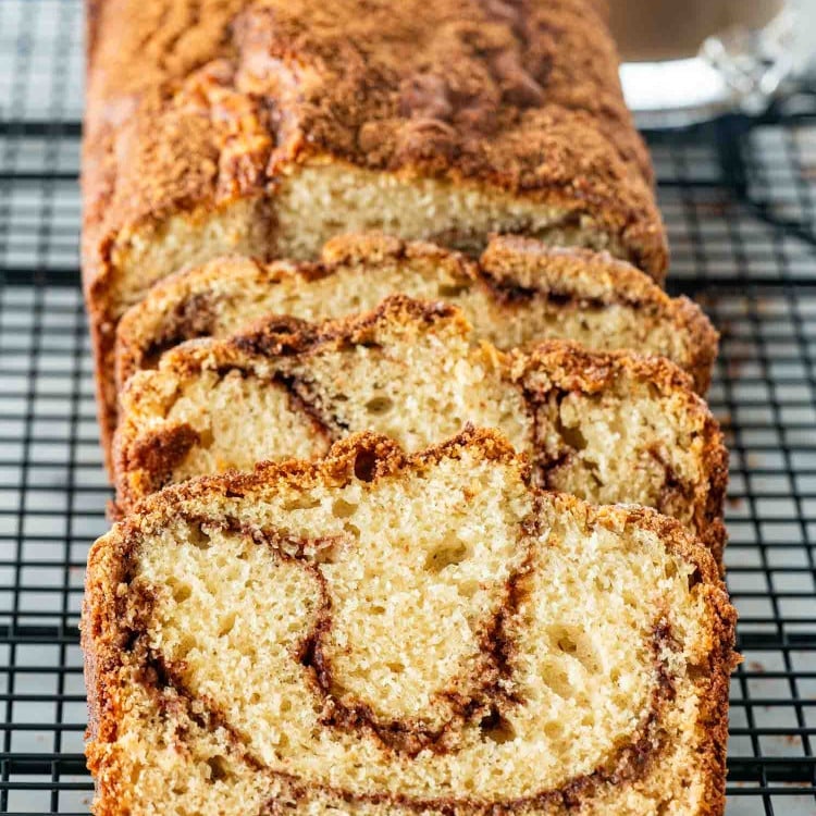 slices of freshly baked coffee cake bread on a cooling rack.