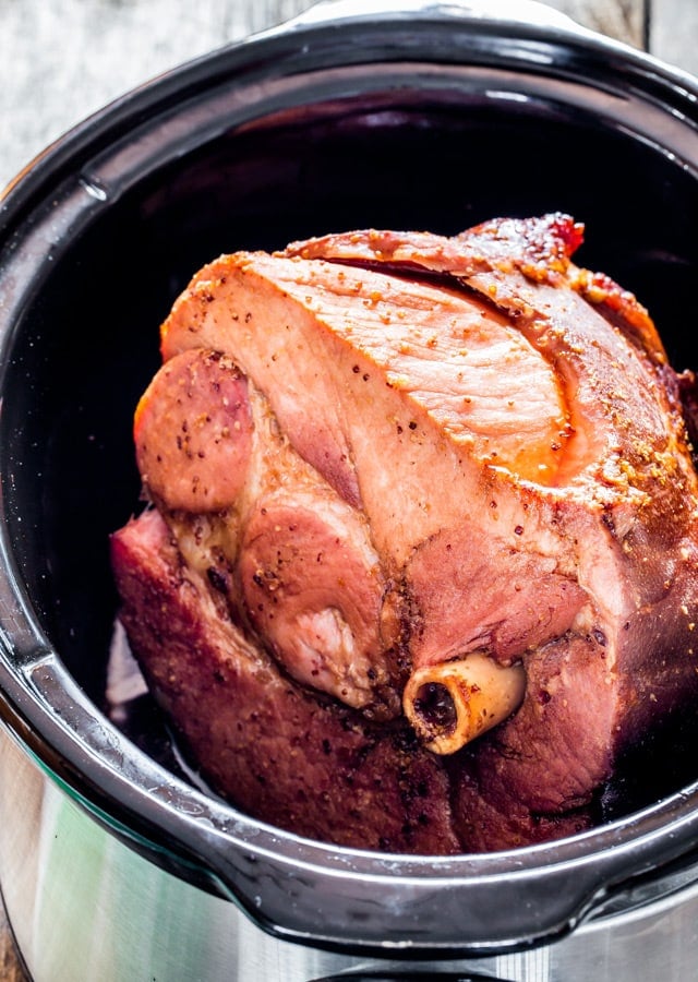 brown sugar cola glazed ham in a black crockpot