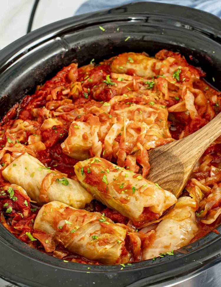 freshly made crockpot cabbage rolls garnished with a bit of parsley.