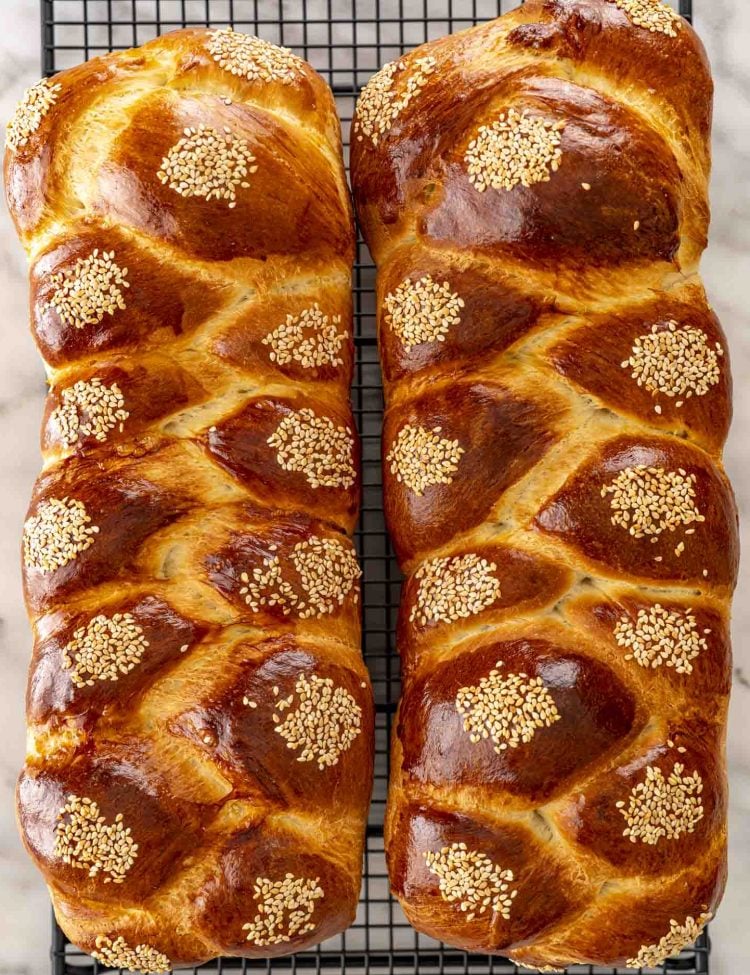 overhead shot of two loaves of braided Easter bread on a cooling rack.