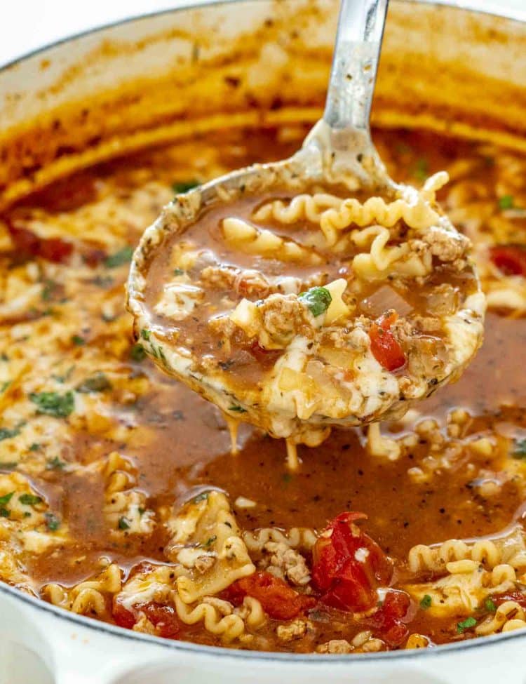 freshly made lasagna soup in a duch oven topped with mozzarella cheese.