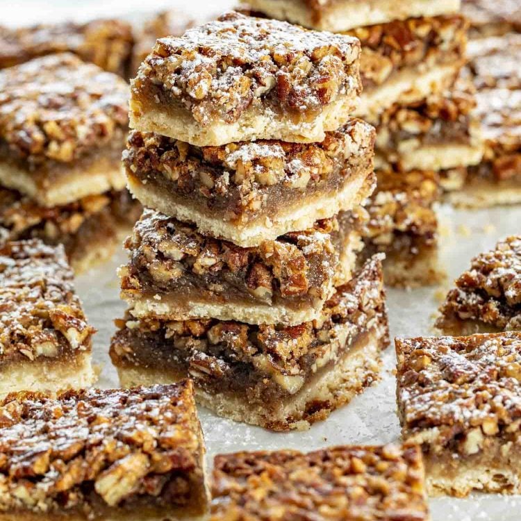 a stack of pecan pie bars.