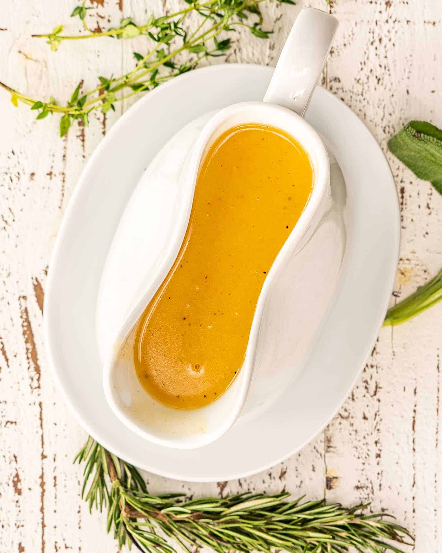 a gorgeous white gravy bowl with turkey gravy.