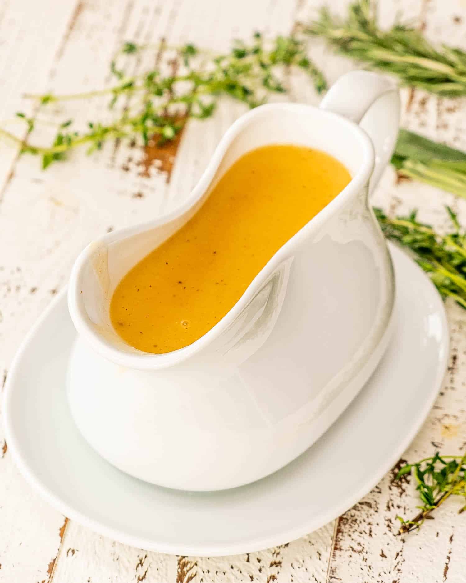 a gorgeous white gravy bowl with turkey gravy.